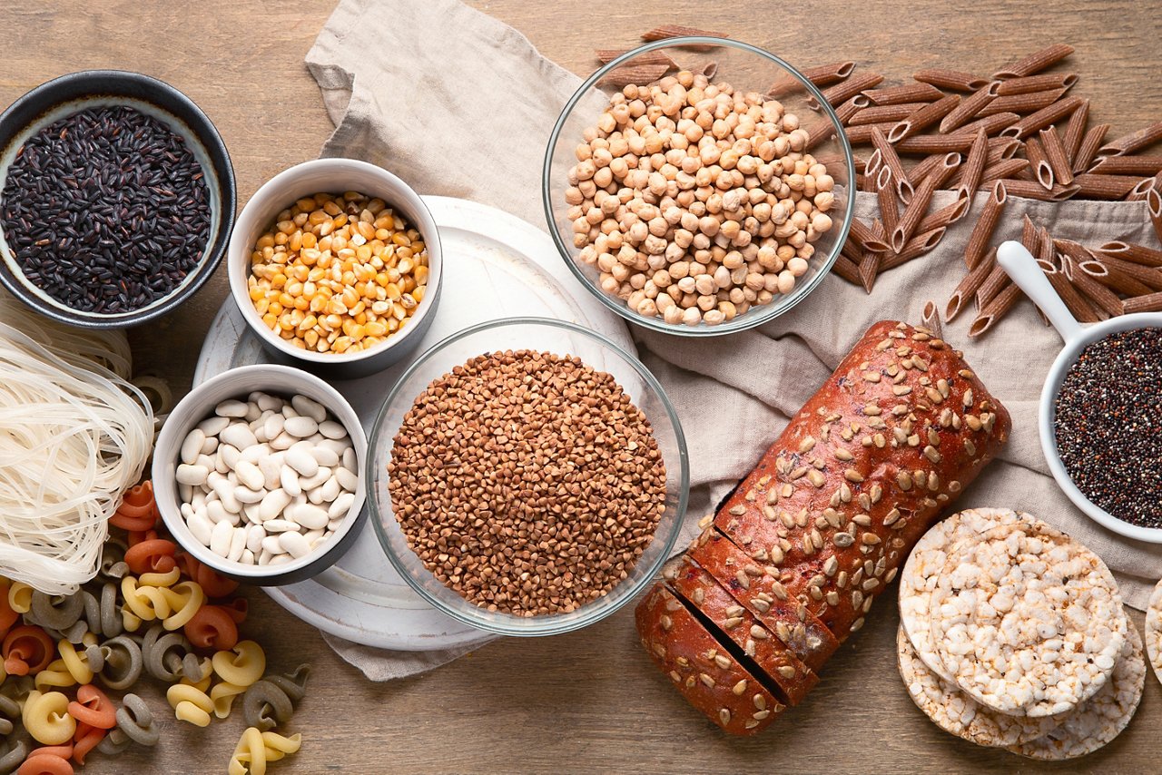 Unrefined carbohydrates and whole foods, such as whole wheat bread, whole wheat pasta, legumes, and pulses