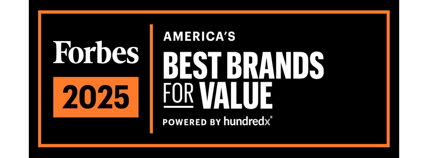 ​​​​Heather Jackson, elite endurance athlete and Herbalife-sponsored runner, stands outdoors in running gear and hydration vest, looking focused before a trail run. 