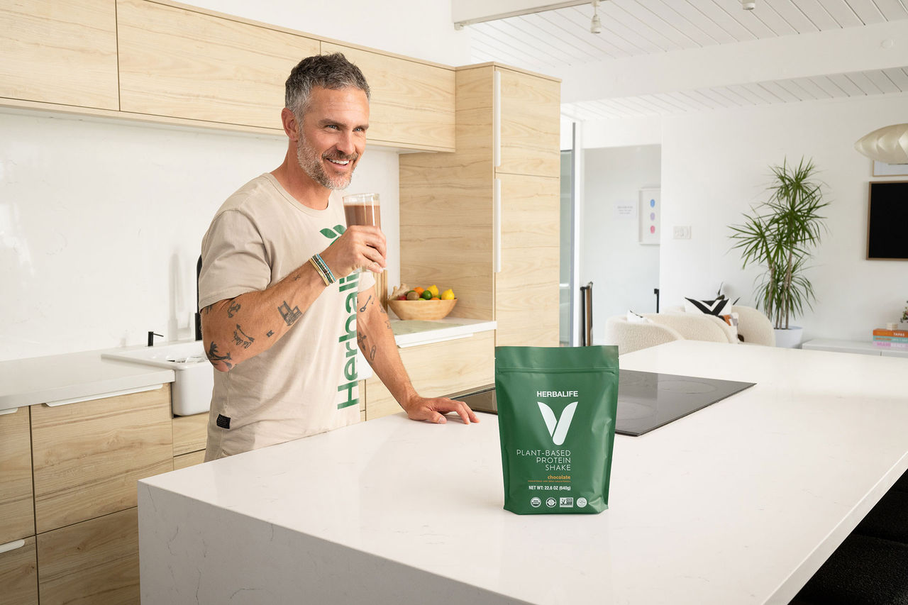 Man enjoying Herbalife V vegan shake